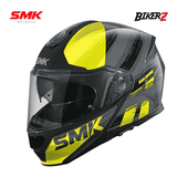 SMK helmet with yellow accents on a white background, featuring SMK and BikerZ logos.