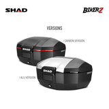 Two SHAD motorcycle boxes, one carbon and one aluminum, on a white background with SHAD and Bikerz branding.