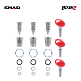 Motorcycle parts including red keys and metallic components on a white background with SHAD and BikerZ branding.